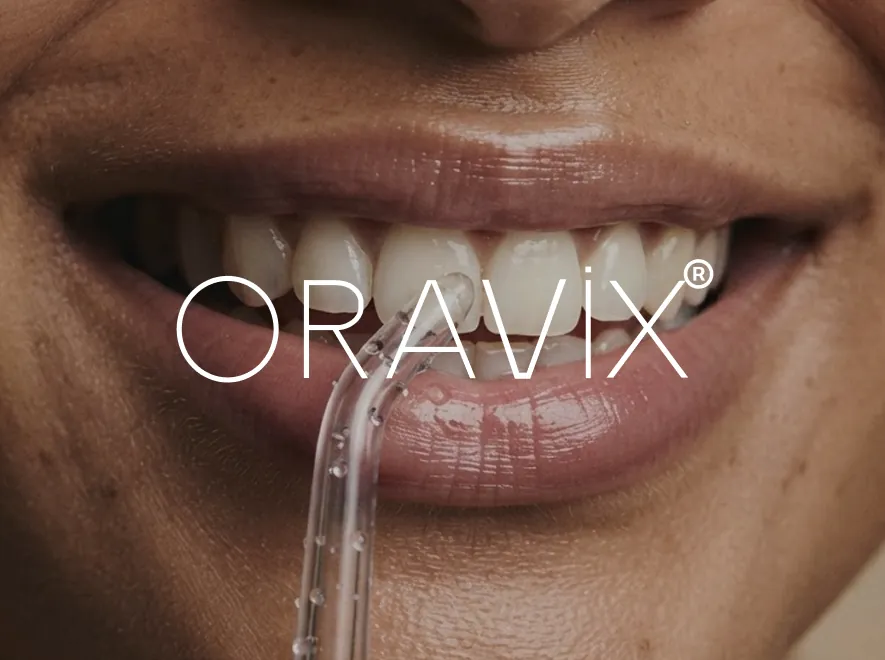 Oravix logo over a smile with a water flosser